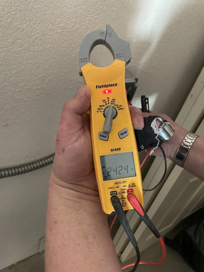 Voltage testing with clamp meter during Electrical Installation Services in Randallstown